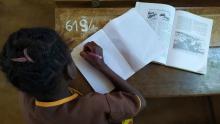 A little girl working on her schoolwork in a school supported by HI. Inclusive education project in the Atsinanana region, Madagascar. | © L. Bluman / HI