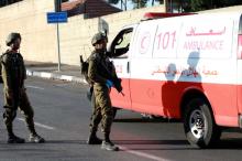 A Palestinian ambulance and Israeli military in Nablus (Credit: © Ayman Nobani)